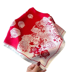 Elegant silk-like square scarf featuring vibrant red rose floral prints and white borders