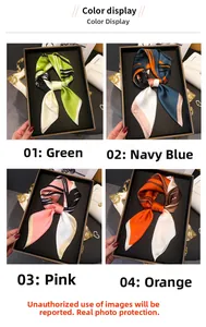 Detail display of square silk scarves in four elegant color patterns on a black tray