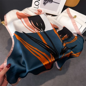 Detailed view of square silk-like scarf featuring abstract tulip floral prints and rolled edges