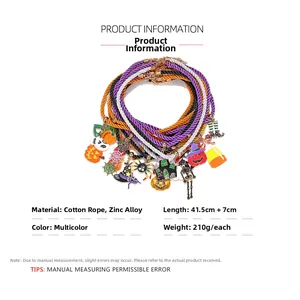 Detailed close-up of colorful Halloween charms including pumpkin and ghost on cotton cords