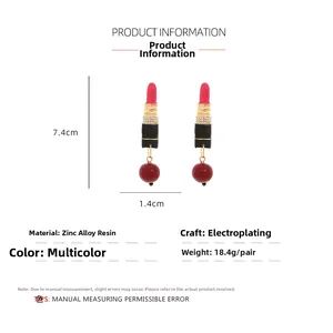 Detail of long lipstick drop earrings showing 7.4cm size and zinc alloy material