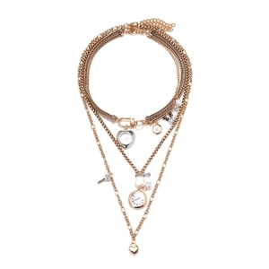 Vintage gold layered necklace with clock heart and Eiffel Tower charms on white backdrop