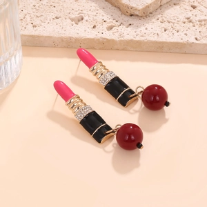 Lipstick drop earrings with red resin beads and crystals on a travertine stone base