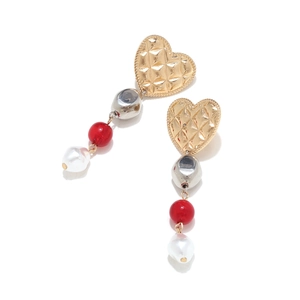 Detail of long drop earrings featuring a gold heart, red beads and baroque pearls