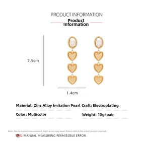 Detailed size chart for long heart-shaped earrings with baroque pearls and zinc alloy