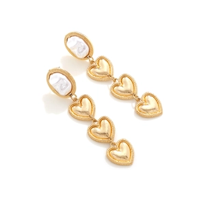 Golden baroque pearl earrings with multi-layered heart pendants in a long drop design