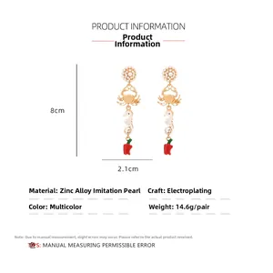 Detailed specs of alloy sea horse and crab drop earrings with pearls and chili pendant