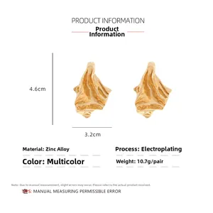Detail view of gold alloy earrings featuring irregular pleated textures and precise dimensions