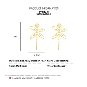 Detailed view of dragonfly pearl earrings showing 10cm height and 5.3cm width dimensions
