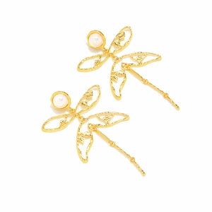 Vintage style gold dragonfly earrings with pearl accent and hollow wing texture on white background