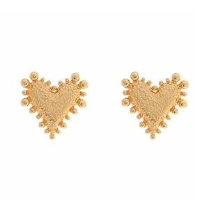Macro detail of golden heart earrings with textured surface and beaded edges