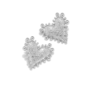 Vintage silver heart stud earrings with beaded edge and textured surface design