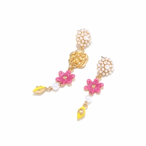 Detailed close-up of asymmetric long lemon floral earrings with pink flowers and pearls
