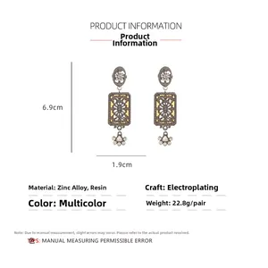 Detailed view showing dimensions 6.9cm by 1.9cm of vintage rhinestone drop earrings