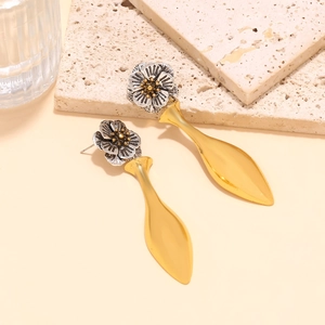 Elegant vintage flower drop earrings with a metallic silver and gold water-drop design