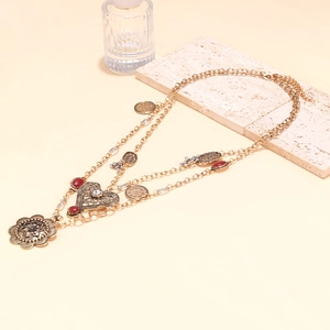 Mehrlagige Vintage-Halskette mit Herz- und Blumenanhängern im böhmischen Goldlook