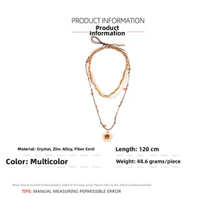 Detail view of multi-layer beaded necklace with flower pendant and material specs