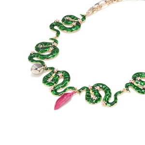 Exaggerated green enamel snake necklace with pink flowers and silver bell leaf pendant