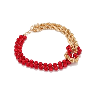 Retro vintage necklace with red beads and chunky gold chain links in a layered design