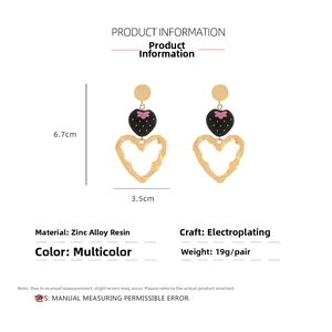 Detail view of large strawberry earrings showing 6.7cm x 3.5cm size and dimensions
