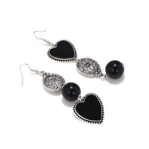Vintage long heart earrings with asymmetrical geometric tassels on white background