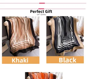 Detail view of khaki and black geometric striped scarves draped over a sofa