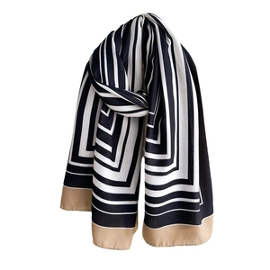 Elegant long silk scarf with black and white geometric stripes and champagne gold edges