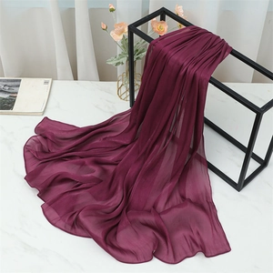 Close-up of deep purple lightweight chiffon scarf with vertical pleated texture and hem detail