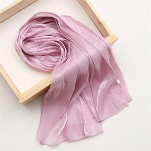 Close-up of lilac lightweight scarf with a silky texture and subtle pearl luster finish