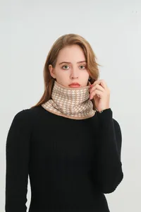 Close-up of thick camel houndstooth knitted neck warmer with plush lining for winter