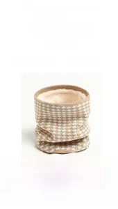 Detailed view of thick houndstooth knit neck warmer with soft fleece lining and high elasticity