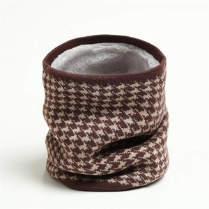 Close-up of winter knit infinity scarf featuring brown houndstooth pattern and thick fleece lining