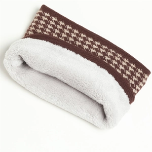 Close-up of knit houndstooth neck warmer featuring soft white thermal fleece lining
