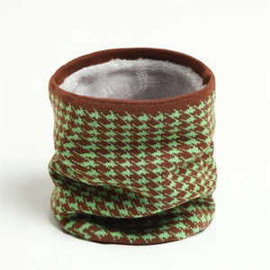 Detail of winter houndstooth knit neck warmer with thick gray fleece lining texture