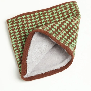 Detail of winter houndstooth knit neck warmer with thick soft fleece lining