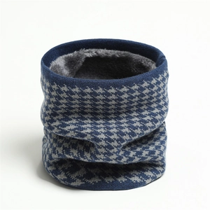 Detailed view of winter neck warmer featuring blue houndstooth knit and thick grey fleece lining