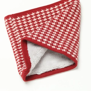 Detail of red houndstooth knit snood featuring thick grey faux fur lining for winter warmth