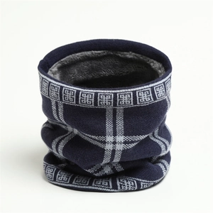 Close-up of winter knit neck warmer with thick gray faux fur lining and blue geometric pattern