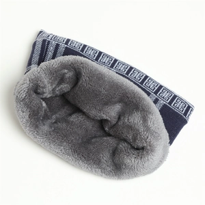 Close-up of winter knit neck warmer with blue geometric pattern and thick grey fleece lining