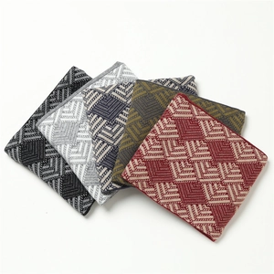 Close-up of geometric jacquard knit pattern on winter neck warmers in multiple colors