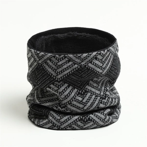 Detail of winter knitted neck warmer featuring grey geometric patterns and thick fleece lining