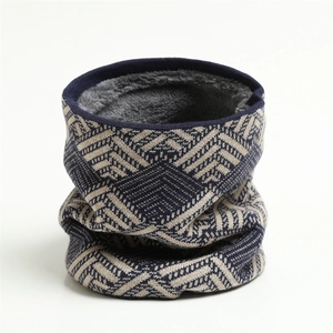 Detail of winter knitted neck warmer featuring navy geometric pattern and soft fleece lining