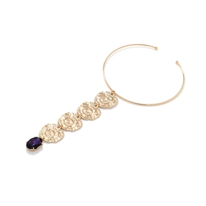 Detail of gold choker with spiral textured coin pendants and purple gemstone drop