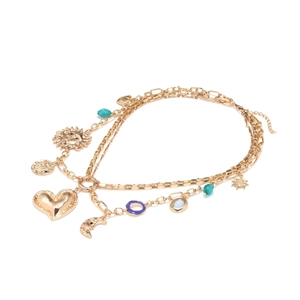 Bohemian multilayer gold necklace featuring heart, sun, and moon charms on white background
