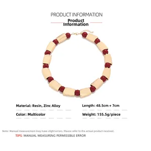 Detail view of bold geometric necklace with 48.5cm length and resin bead accents