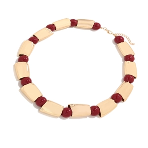 Statement necklace with gold geometric alloy links and deep red resin beads for women