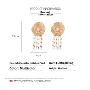 Detail view of gold flower earrings with pearl tassels showing 8.8cm length dimensions