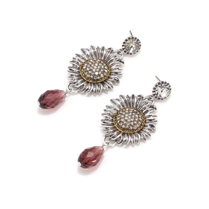 Detail of luxury sunflower earrings with gold crystals and purple teardrop crystal beads