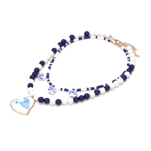 Multilayer beaded necklace with blue white porcelain heart pendant and gold metal trim