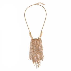 Statement gold-tone multi-strand fringe tassel necklace with polished curved metal tubes